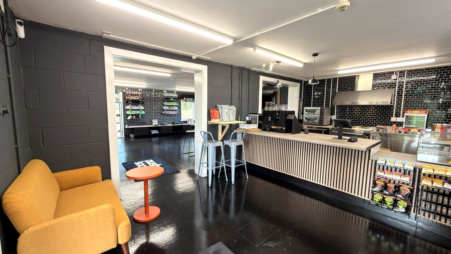 Real shop and café seating with counter and skate retail area beyond