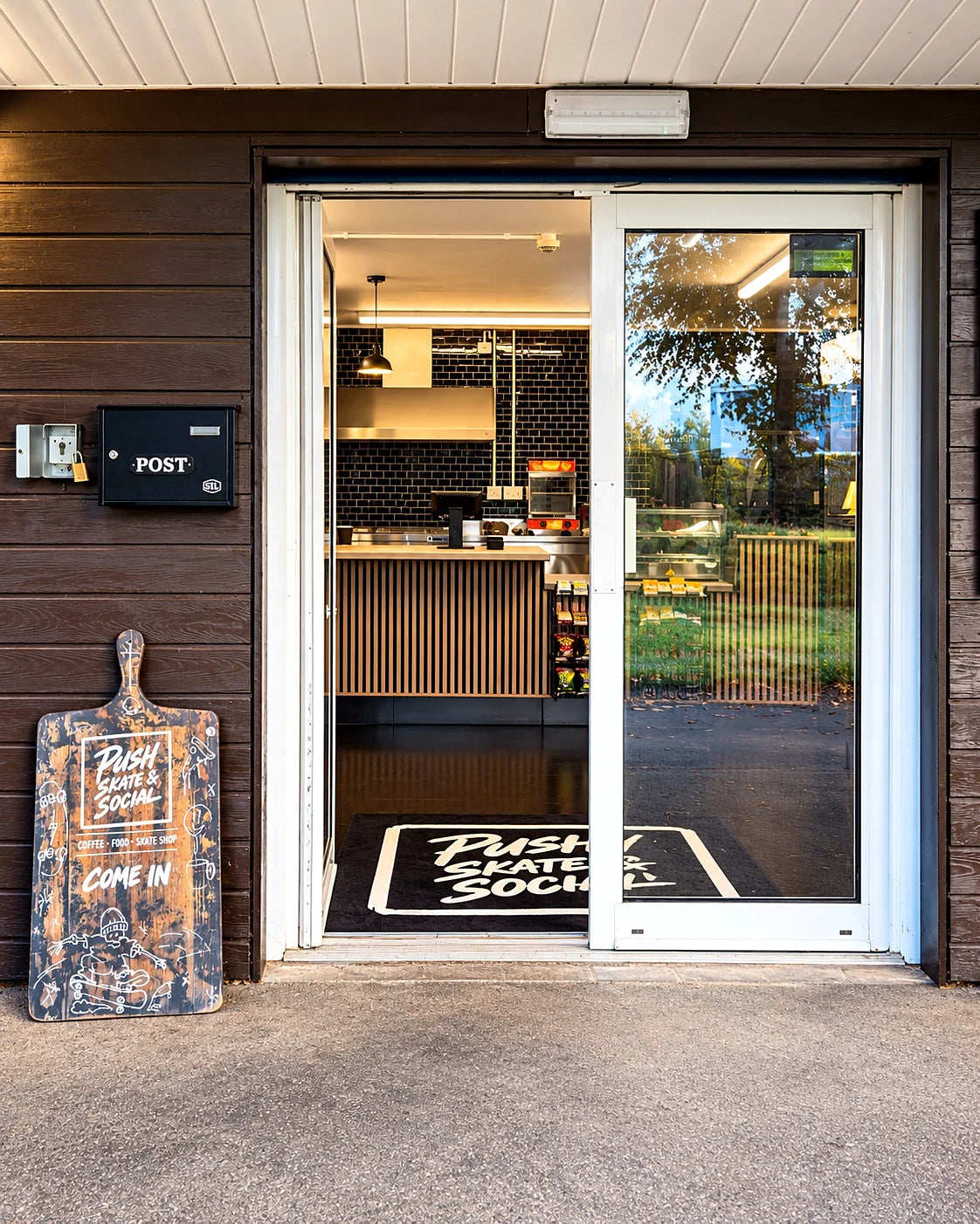 Push Skate and Social entrance at Radlands, with a custom-painted welcome sign