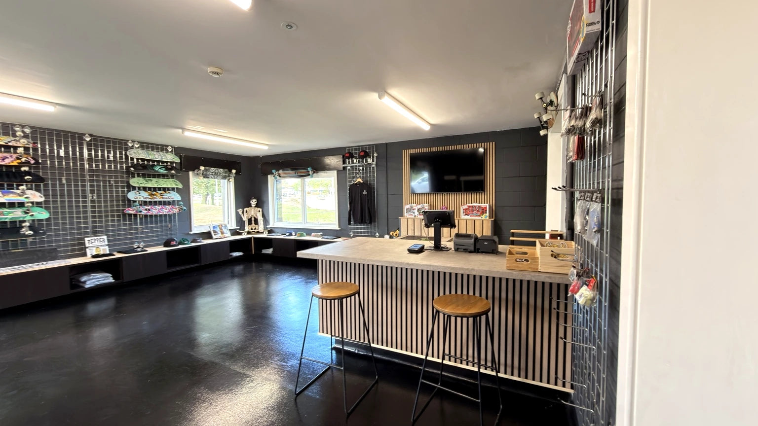Push Society shop checkout counter with timber slats and skateboard display walls