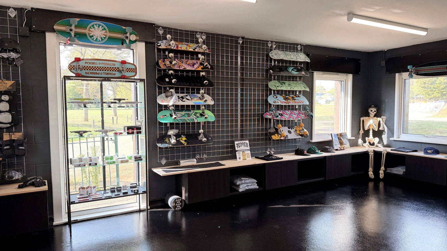 Actual skateboard deck display inside Push Society at Radlands