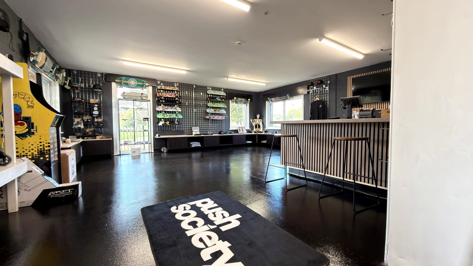 Real view of the Push Society shop at Radlands, showing the skateboard displays and counter