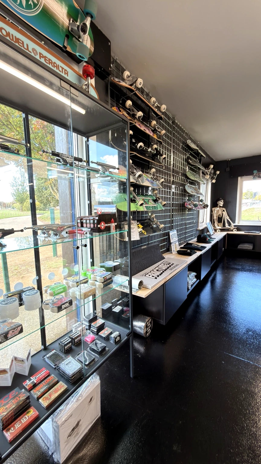 Real glass display case in Push Society containing trucks, wheels, bearings and accessories