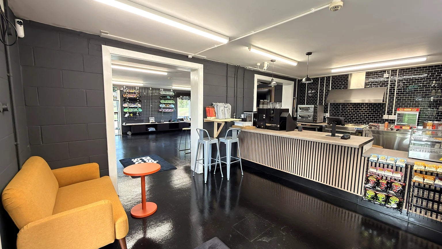 Long timber café counter and glass food display